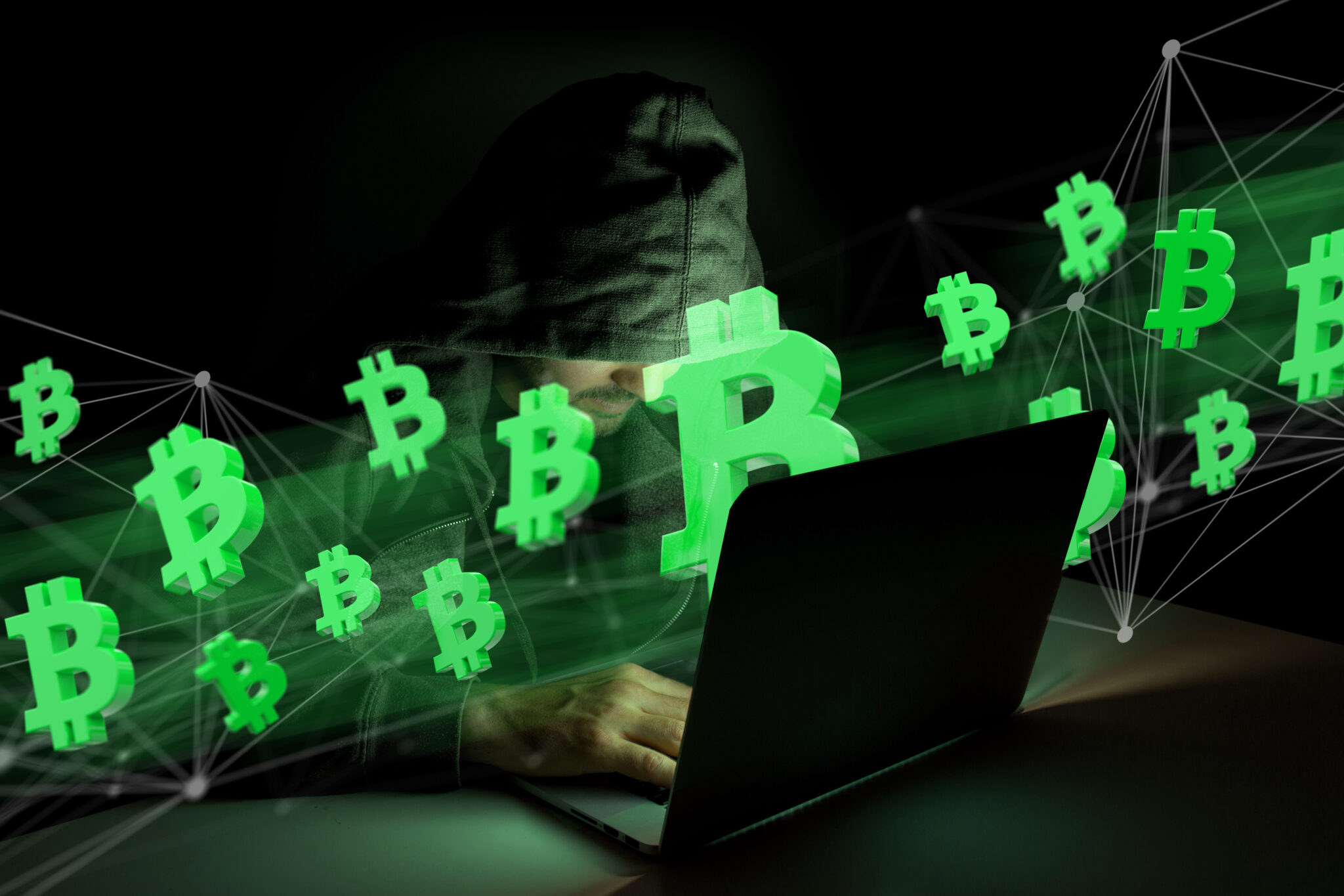 Hacker man in dark using computer to hack data and information system